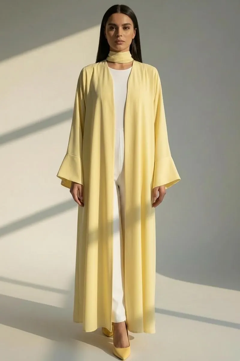 Model wearing a pastel yellow open abaya